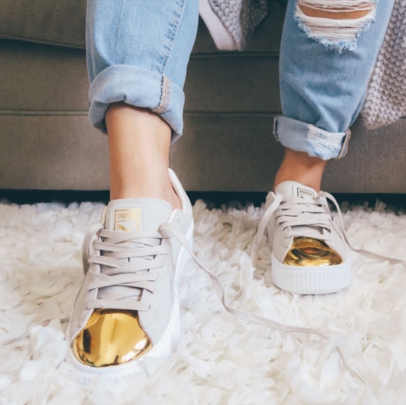 white pumas with gold toe